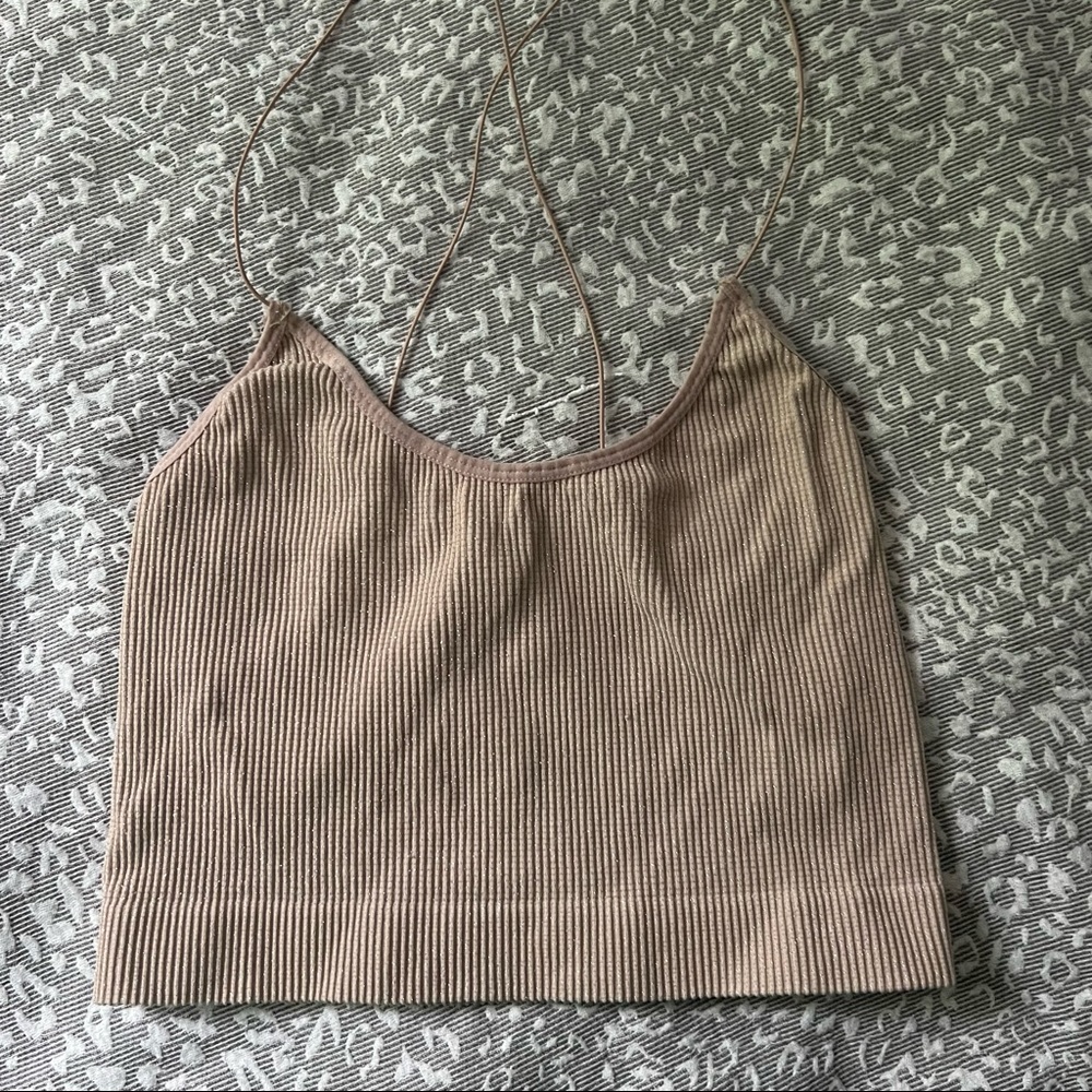 out from under sparkly nude tank top